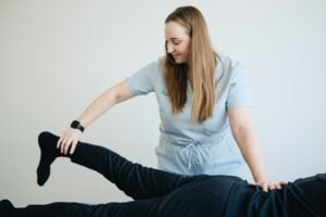 Physical therapist reviewing continuing education materials with colleague